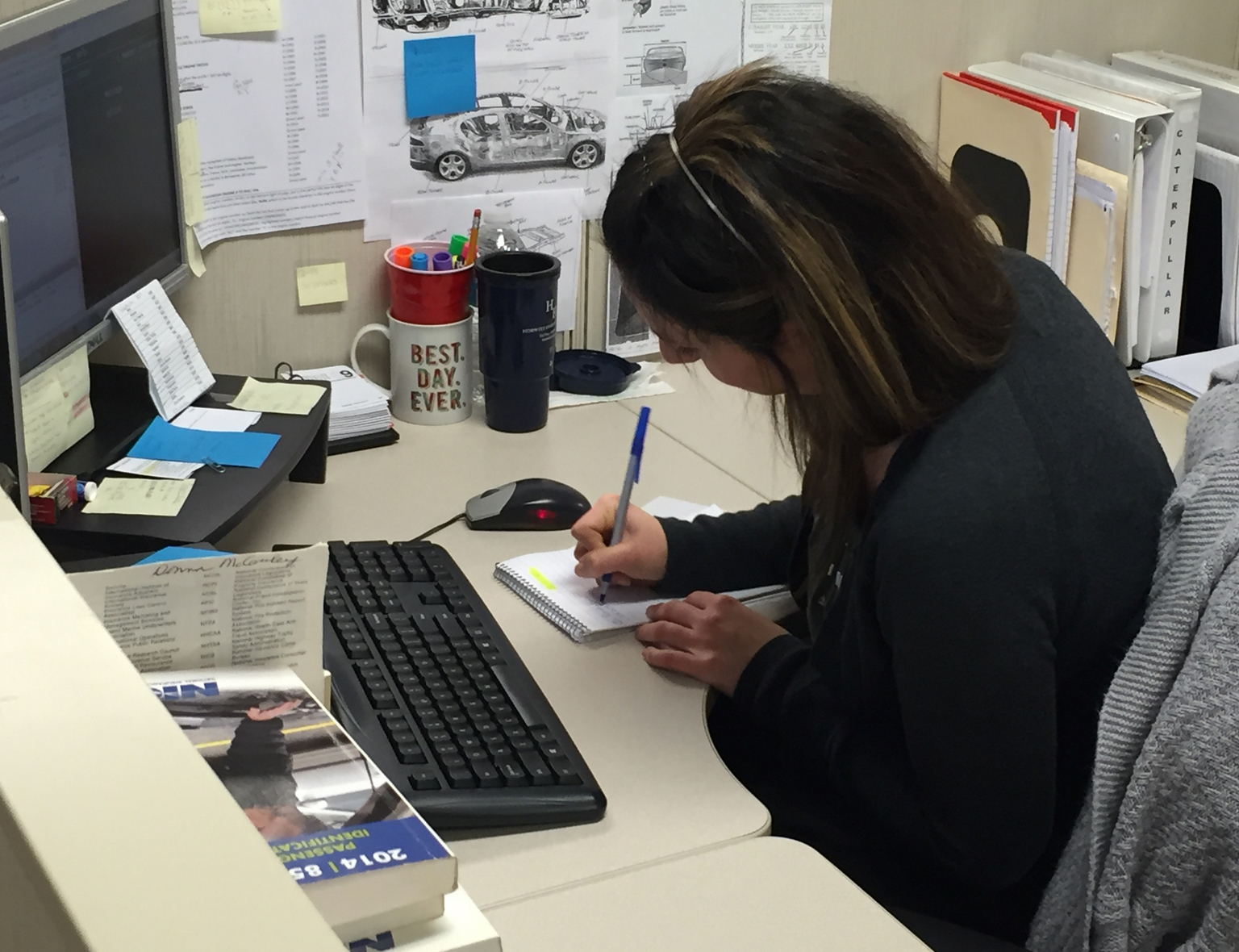 An NICB employee at her desk