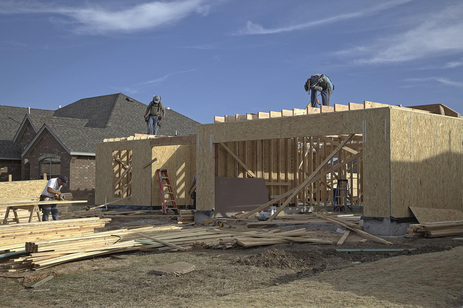 Construction workers rebuilding a house